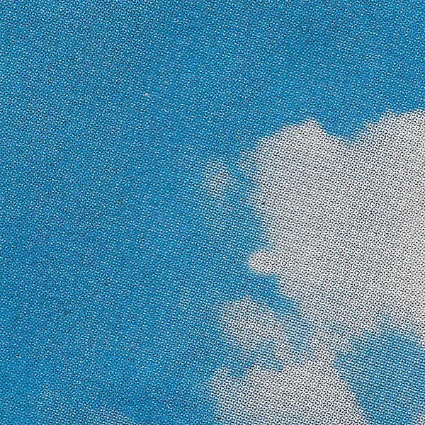 Halftone scan of a blue sky with clouds
