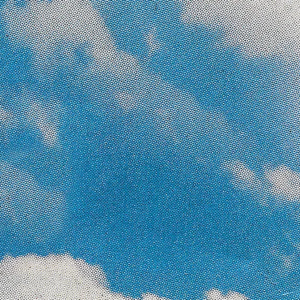Halftone scan of a blue sky with a bank of clouds